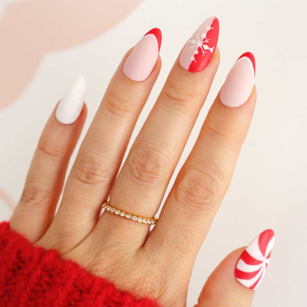 red and white peppermint christmas nails for winter