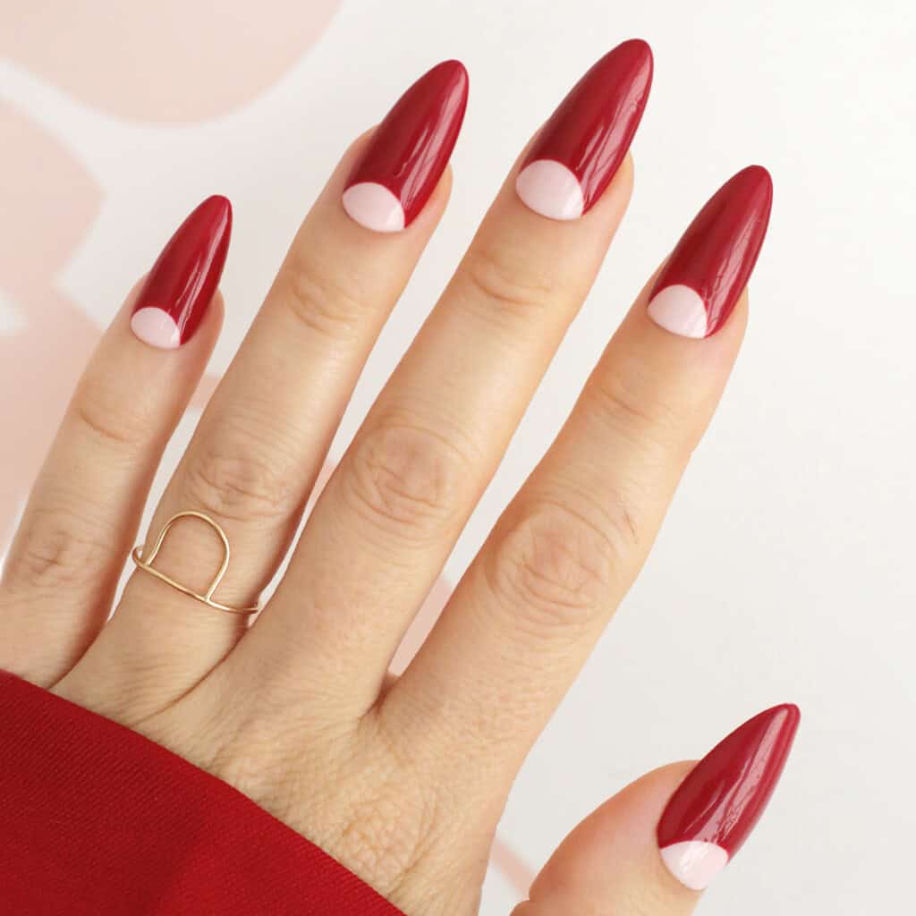 cranberry red christmas reverse french tip nails